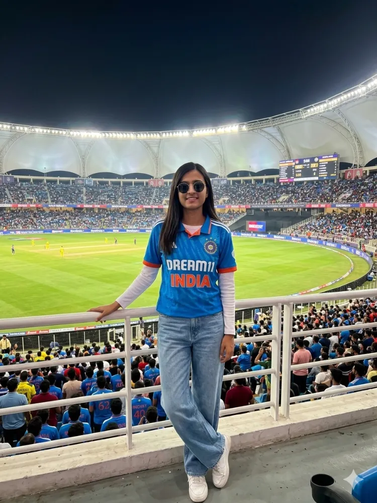 Woman Wearing Team India Cricket Jersey at a Cricket Stadium